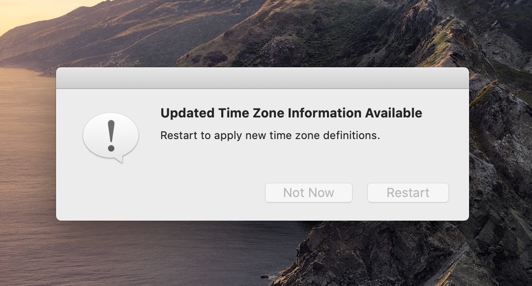 A screenshot of a MacOS dialog message that says: “Updated Time Zone Information Available. Restart to apply new time zone definitions.”